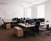 IT open space office. Computer Work Stations. Office Workplace with windows.